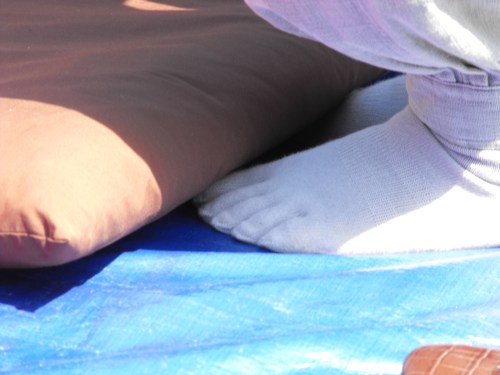 Ajuma wearing toe socks An ajuma works a pair of toe socks at the Gu In Jung Sa Temple's sungmoo on Sunday, April 4, 2010.