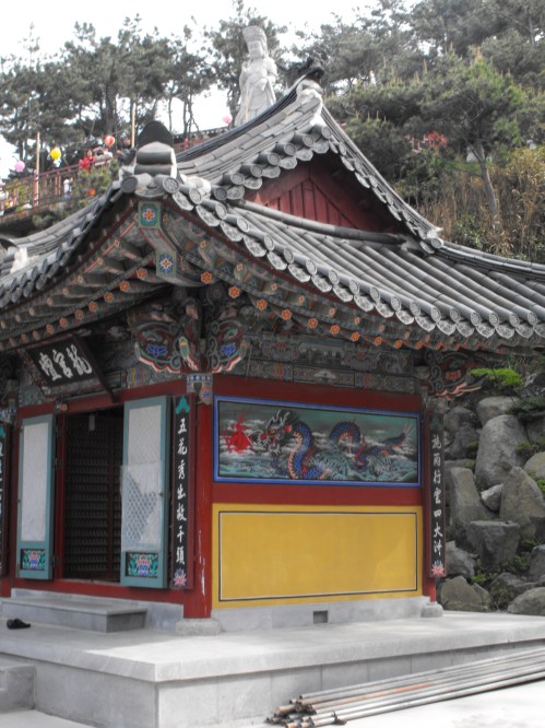 A statue of the Great Goddess Buddha of Mercy towers over one of the small temples at Haedong Yonggungsa. This is apparently the largest statue in South Korea carved from a single piece of stone. I don't believe the steel rods have any special significance.