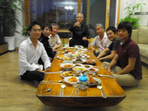 The Dudes The menfolk sitting around enjoying Scotch while the womenfolk put the finishing touches on dinner and bring the food to the table.